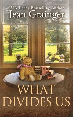 Jean Grainger - What Divides Us, Inbunden
