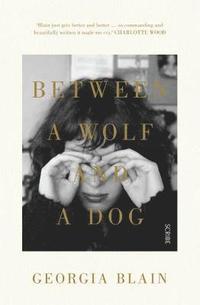 bokomslag Between a Wolf and a Dog