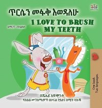 bokomslag I Love to Brush My Teeth (Amharic English Bilingual Book for Kids)