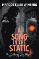 bokomslag A Song in the Static: She Followed the Signal. Something Answered.
